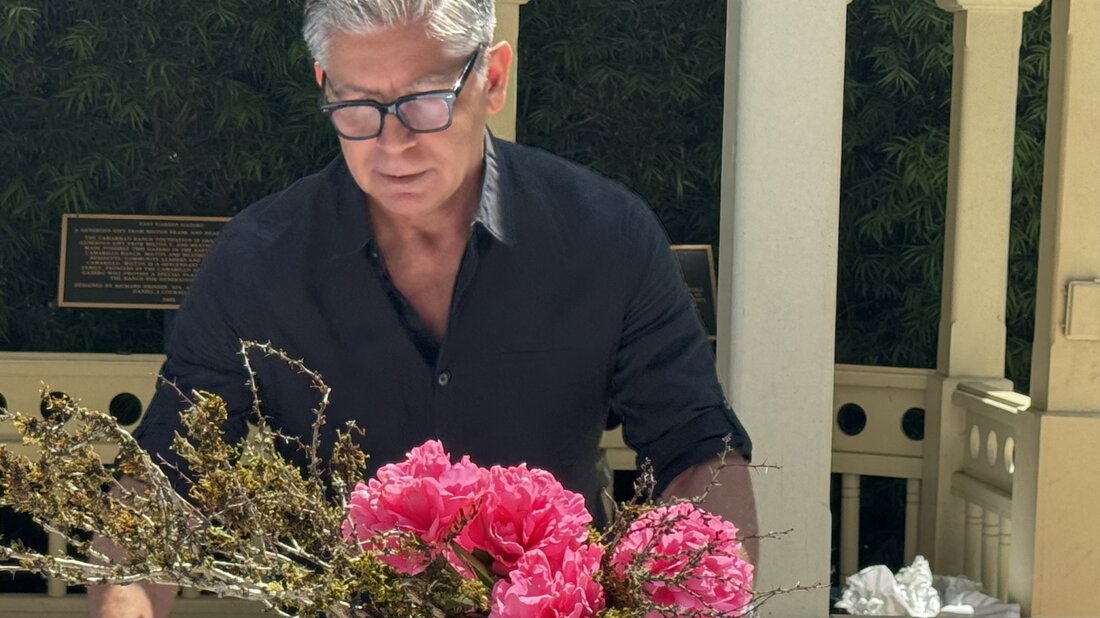 Gabriel Pacheco works on a small ikebana demonstration