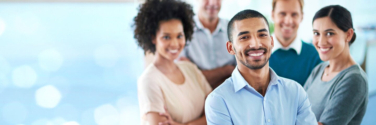 group of smiling team members